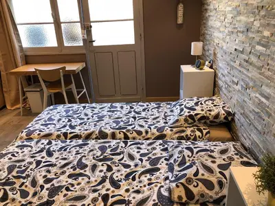 Un ou plusieurs lits dans un hébergement de l'établissement Centre de vacances Hotel CAPLANDES