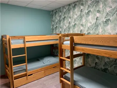 Un ou plusieurs lits dans un hébergement de l'établissement Centre de vacances Hotel CAPLANDES