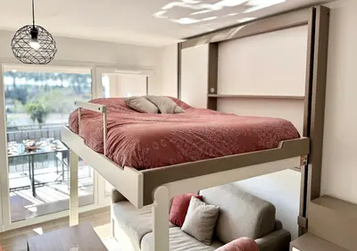 Un ou plusieurs lits dans un hébergement de l'établissement Biscawaï studio spacieux et cosy