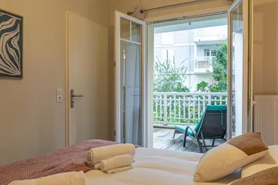 Un ou plusieurs lits dans un hébergement de l'établissement Chez Benjamin - Appt terrasse avec piscine commune
