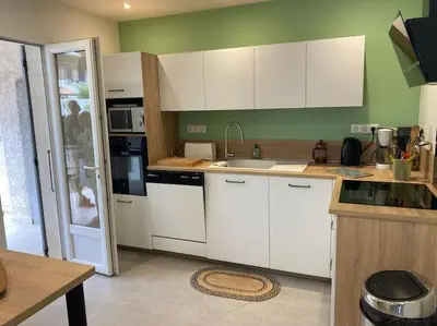 Cuisine ou kitchenette dans l'établissement Maison agréable à La Teste-de-Buch