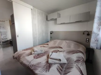 Un ou plusieurs lits dans un hébergement de l'établissement Mobile home à Mimizan géré par un particulier
