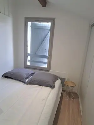 Un ou plusieurs lits dans un hébergement de l'établissement Maisonnette 2 chambres à deux pas des plages