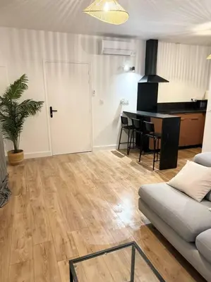 Coin salon dans l'établissement Appartement Éloi - 1 Chambre