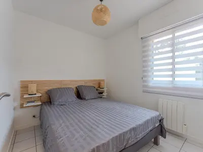 Un ou plusieurs lits dans un hébergement de l'établissement Appartement T2 refait à neuf - 4 pers - Terrasse Ouest - Proche centre - Chiens OK - FR-1-521-237