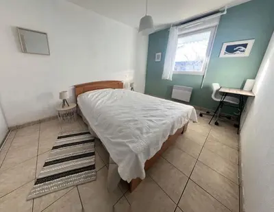 Un ou plusieurs lits dans un hébergement de l'établissement T2 4 couchage à 2 pas du bassin
