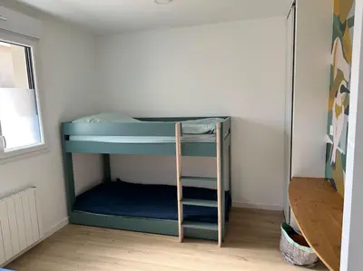 Un ou plusieurs lits dans un hébergement de l'établissement Très bel appartement neuf - Parking et Terrasse