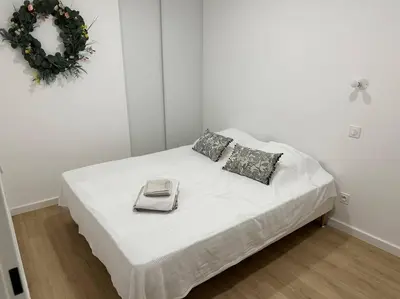 Un ou plusieurs lits dans un hébergement de l'établissement Très bel appartement neuf - Parking et Terrasse