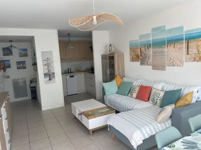 Coin salon dans l'établissement Appartement de charme T3 avec petit jardin et parking