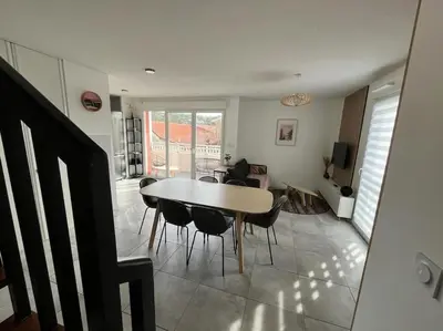 Coin salon dans l'établissement Spacieux appartement neuf au cœur de Bisca plage