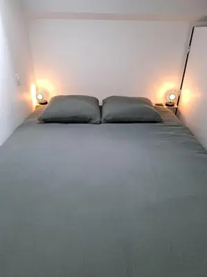 Un ou plusieurs lits dans un hébergement de l'établissement Appartement cosy 2 chambres - 300m de la plage