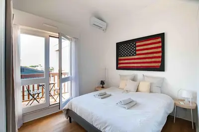 Un ou plusieurs lits dans un hébergement de l'établissement Le Landifornia - Design cosy & horizon bleu avec vue océan