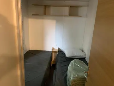 Un ou plusieurs lits dans un hébergement de l'établissement Mobil-Home -10 minutes Océan