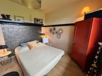 Un ou plusieurs lits dans un hébergement de l'établissement La Cabane Farwest Plein pied vue PIN proche LAC