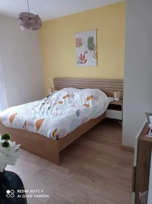 Un ou plusieurs lits dans un hébergement de l'établissement Maison cosy à côté de Biscarrosse