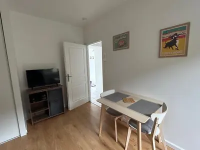 Télévision ou salle de divertissement dans l'établissement Studio T1