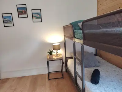 Un ou plusieurs lits dans un hébergement de l'établissement Maison chaleureuse au calme