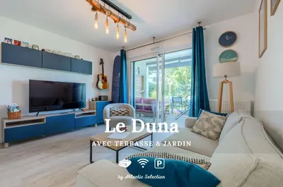 Télévision ou salle de divertissement dans l'établissement Atlantic Selection - Le Duna - Ambiance zen avec terrasse & parking