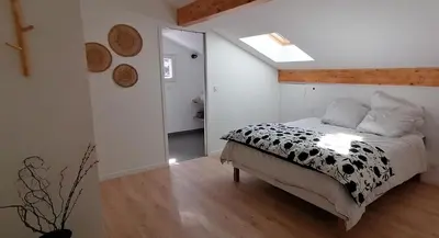 Un ou plusieurs lits dans un hébergement de l'établissement Oïhana Villa & Suites - Piscine chauffée - 4km de la plage