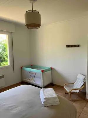 Un ou plusieurs lits dans un hébergement de l'établissement Maison Mimizan plage