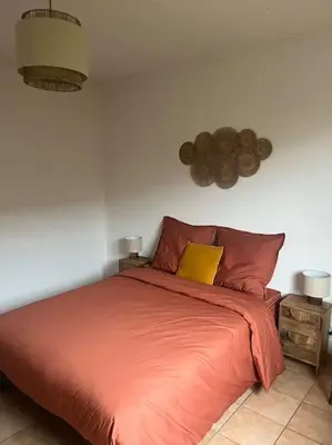 Un ou plusieurs lits dans un hébergement de l'établissement Maison Mimizan plage