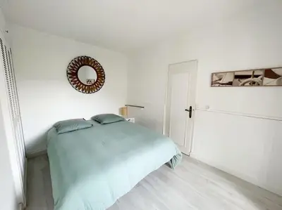Un ou plusieurs lits dans un hébergement de l'établissement Charmante maison pour 6 personnes