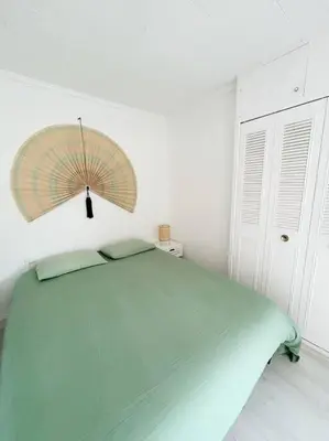 Un ou plusieurs lits dans un hébergement de l'établissement Charmante maison pour 6 personnes