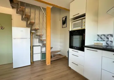 Cuisine ou kitchenette dans l'établissement Chalet Paisible proche du Lac