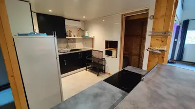 Cuisine ou kitchenette dans l'établissement Le studio rustique du Bassin
