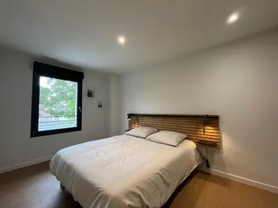 Un ou plusieurs lits dans un hébergement de l'établissement Villas-des-oyats - Arena - 8 personnes climatisée piscine chauffée