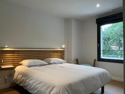 Un ou plusieurs lits dans un hébergement de l'établissement Villas-des-oyats - Arena - 8 personnes climatisée piscine chauffée
