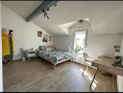 Un ou plusieurs lits dans un hébergement de l'établissement Maison de vacances au centre Biscarrosse