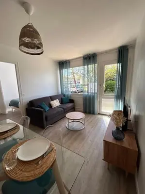 Coin salon dans l'établissement Appartement 4 personnes Mimizan