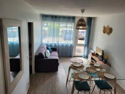 Coin salon dans l'établissement Appartement 4 personnes Mimizan