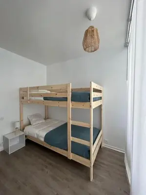 Un ou plusieurs lits dans un hébergement de l'établissement Appartement 4 personnes Mimizan