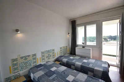 Un ou plusieurs lits dans un hébergement de l'établissement HOSSEGOR RAYON VERT - En front de mer superbe vue océan, plages, Pyrénées, estacade et pinède