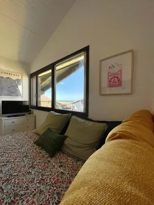 Coin salon dans l'établissement COSY & SURF : Confort et vue Mer à Seignosse Le Penon