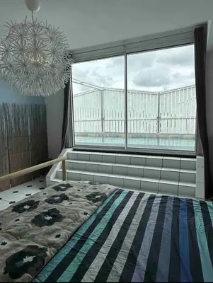 Un ou plusieurs lits dans un hébergement de l'établissement Roof top piscine chauffée 7 pers wifi
