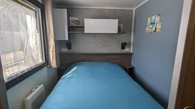 Un ou plusieurs lits dans un hébergement de l'établissement Mobil-home 40m2 au calme, plage, piscine, forêt