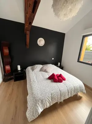 Un ou plusieurs lits dans un hébergement de l'établissement Villa calme