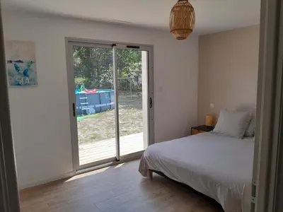 Un ou plusieurs lits dans un hébergement de l'établissement Magnifique maison de plein pied