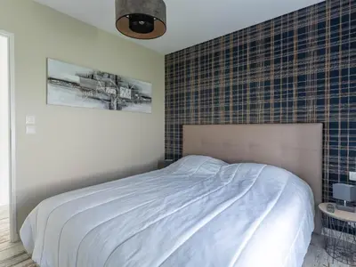 Un ou plusieurs lits dans un hébergement de l'établissement Maison climatisée à Parentis-en-Born, 3 chambres, jardin, proche centre et activités, ménage inclus - FR-1-319-554
