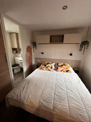 Un ou plusieurs lits dans un hébergement de l'établissement Grand Mobil Home Tout Confort pour 6 personnes - Camping Les Oyats 4 étoiles