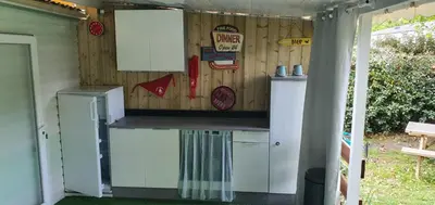 Cuisine ou kitchenette dans l'établissement Mobile home Mimizan