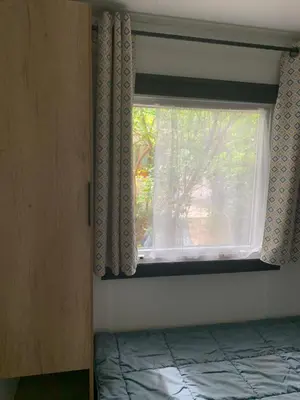 Un ou plusieurs lits dans un hébergement de l'établissement MH 008 Bora Bora sur emplacement exceptionnel en lisière de forêt dans camping 4 étoiles