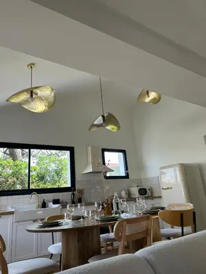Télévision ou salle de divertissement dans l'établissement Beach House Paupiette - 150m plage sud