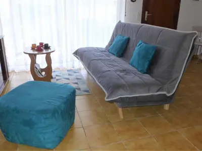 Coin salon dans l'établissement Holiday Home Bosquet aux Ecureuils by Interhome