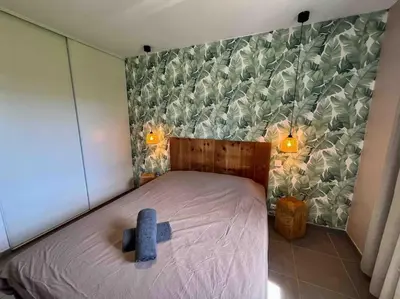 Un ou plusieurs lits dans un hébergement de l'établissement La Cabane de Sofi Villa Cosy Piscine 8 PERS