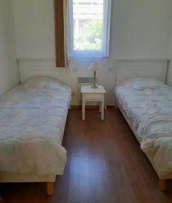 Un ou plusieurs lits dans un hébergement de l'établissement Cottage prenium tout confort