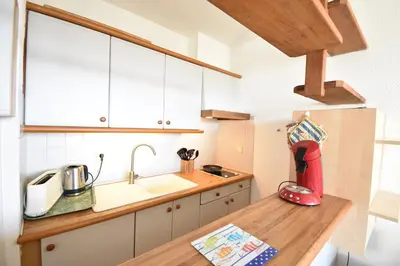 Cuisine ou kitchenette dans l'établissement Résidence Les Terrasses de Notre Dame, bel appartement avec vue sur l'entrée du port